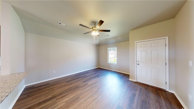 interior space with ceiling fan and dark hardwood / wood-style flooring