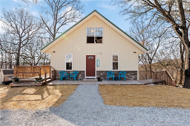 view of front of house featuring a patio area and a wooden deck