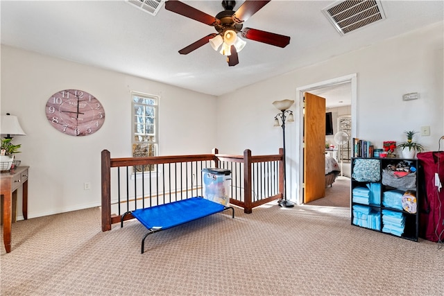 sitting room with carpet flooring and ceiling fan