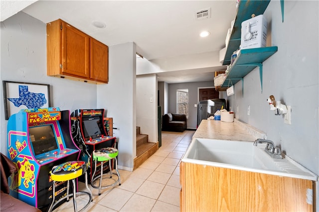 kitchen with light tile patterned flooring