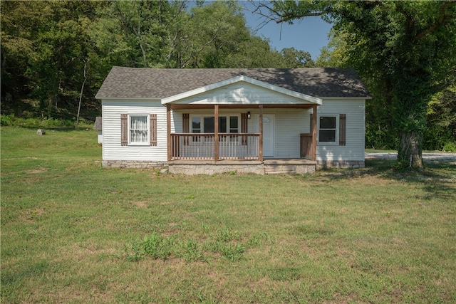 view of front of house featuring a front yard and covered porch