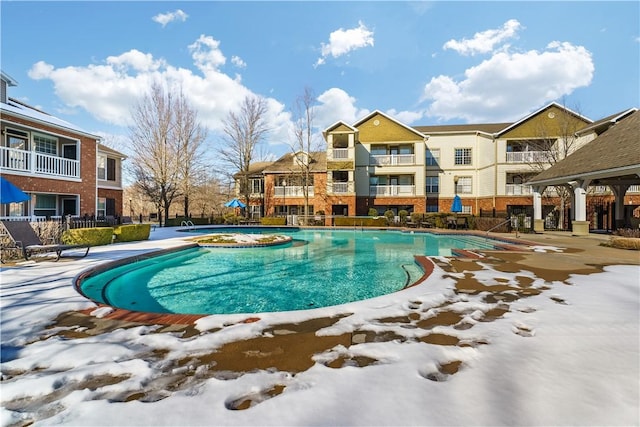 view of swimming pool with a patio area and a hot tub