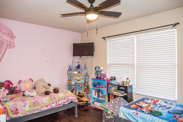 bedroom featuring wood-type flooring and ceiling fan