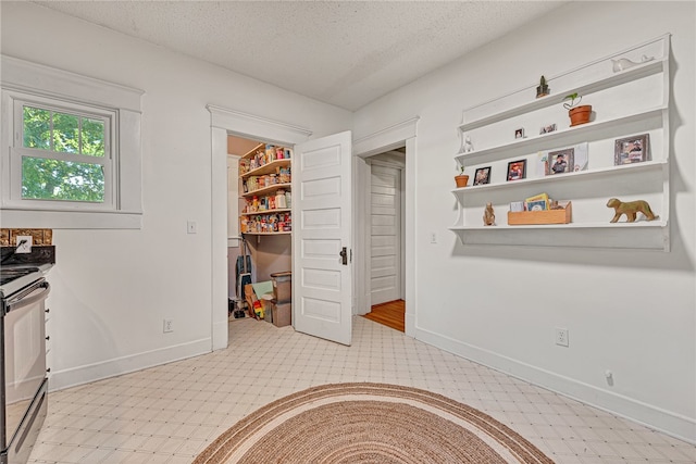 interior space featuring a textured ceiling