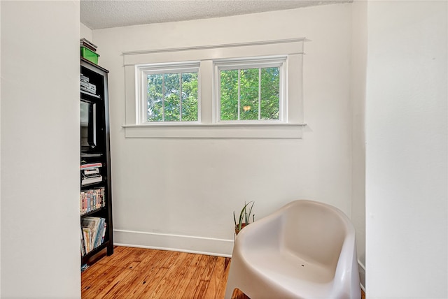 bathroom featuring a textured ceiling and hardwood / wood-style floors