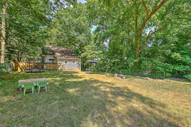 view of yard featuring a trampoline