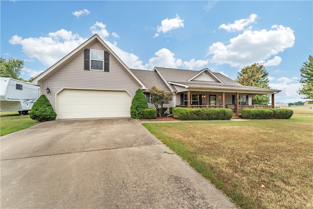 view of front of property with a front lawn, a porch, and a garage