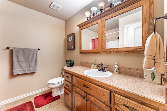 bathroom with tile patterned flooring, walk in shower, vanity, and toilet