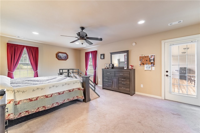 carpeted bedroom featuring ceiling fan and access to exterior