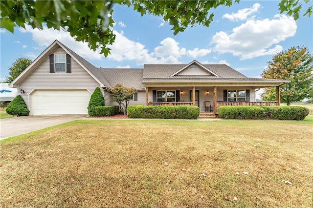 view of front facade with a front yard and covered porch