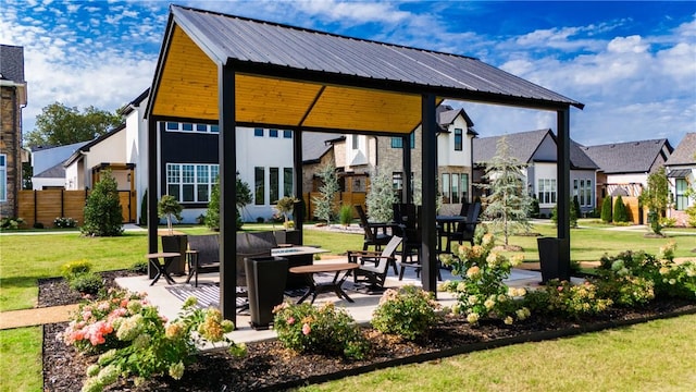 view of patio / terrace featuring a residential view and a fire pit