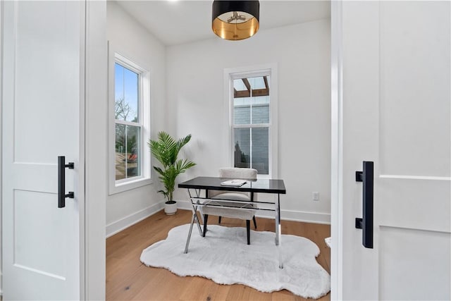 office area featuring wood finished floors and baseboards