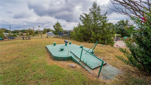 entry to storm shelter featuring a lawn