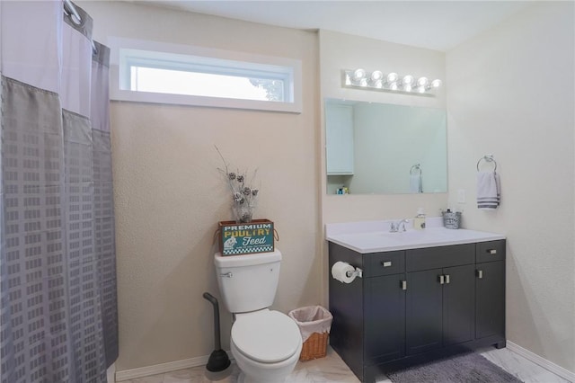 bathroom with vanity, a shower with curtain, and toilet