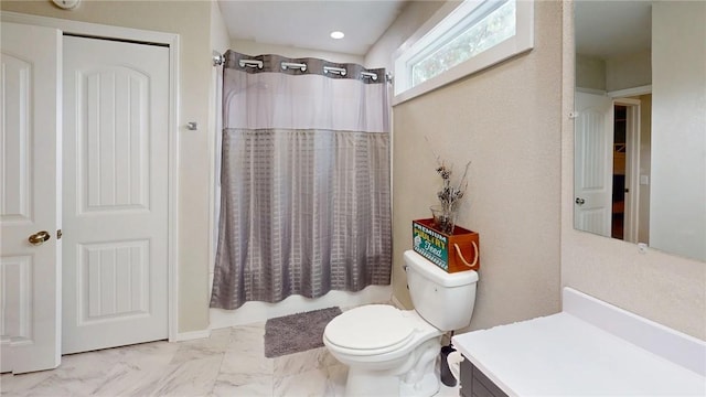 bathroom with vanity, toilet, and walk in shower