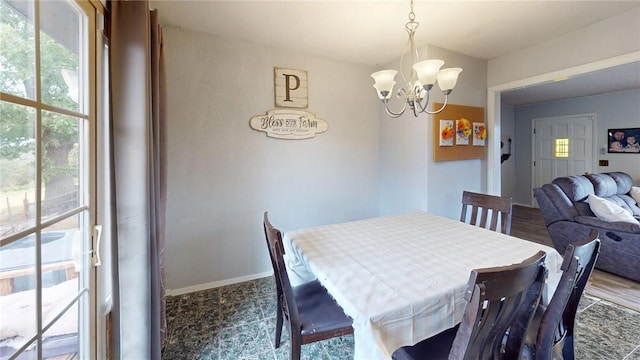 dining space with a chandelier