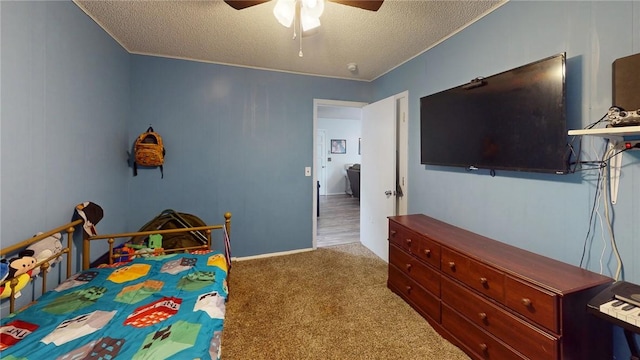 bedroom featuring a textured ceiling, ceiling fan, and light colored carpet