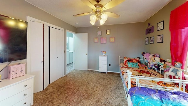 bedroom with carpet, ceiling fan, and washer / clothes dryer