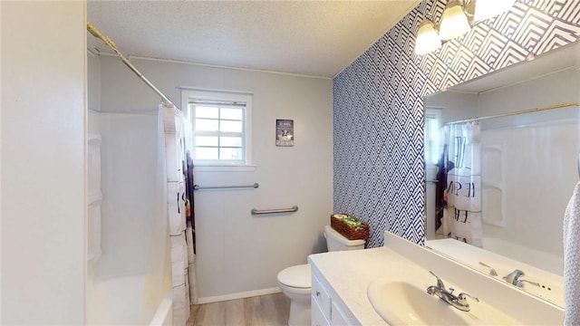 full bathroom featuring hardwood / wood-style flooring, toilet, shower / bath combination with curtain, a textured ceiling, and vanity