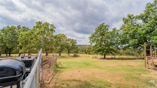 view of yard with a rural view