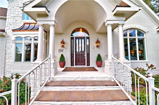 6532 Western Trails Dr, Springdale, AR 72762 - doorway to property with a standing seam roof, metal roof, and brick siding