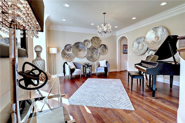 6532 Western Trails Dr, Springdale, AR 72762 - sitting room featuring a chandelier, arched walkways, ornamental molding, and wood finished floors