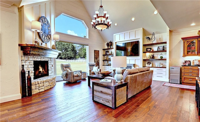 living room with a fireplace, a chandelier, dark wood-type flooring, and high vaulted ceiling