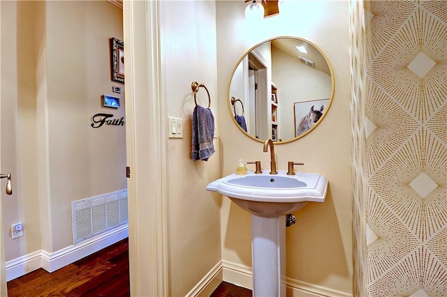 6532 Western Trails Dr, Springdale, AR 72762 - bathroom featuring visible vents, baseboards, and wood finished floors