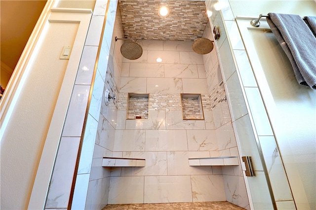 bathroom with tiled shower