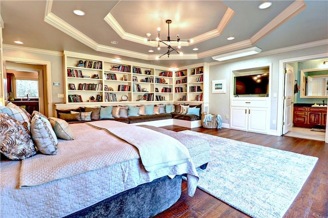 6532 Western Trails Dr, Springdale, AR 72762 - bedroom with a notable chandelier, ensuite bathroom, crown molding, a raised ceiling, and wood finished floors