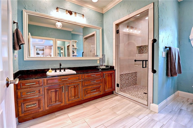 bathroom featuring a tile shower, ornamental molding, and vanity