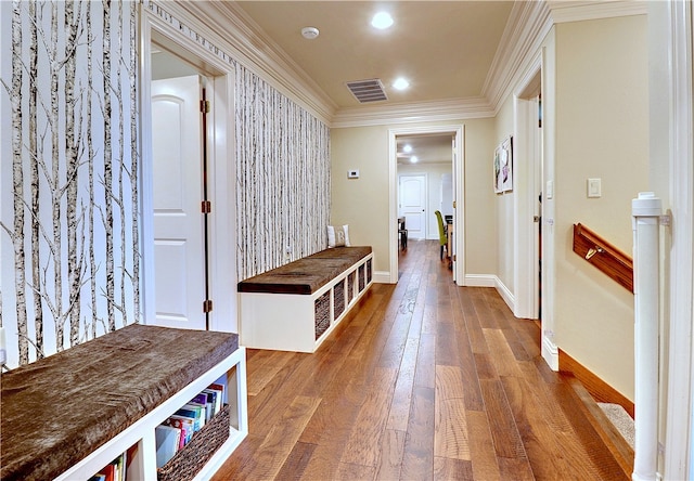 hallway featuring crown molding and hardwood / wood-style floors