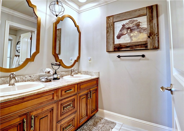 bathroom with ornamental molding, vanity, and tile patterned floors