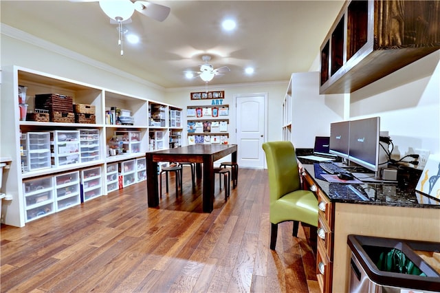 home office featuring ornamental molding, ceiling fan, and hardwood / wood-style floors