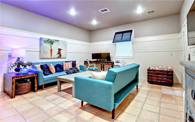6532 Western Trails Dr, Springdale, AR 72762 - living room with light tile patterned floors, wainscoting, and visible vents
