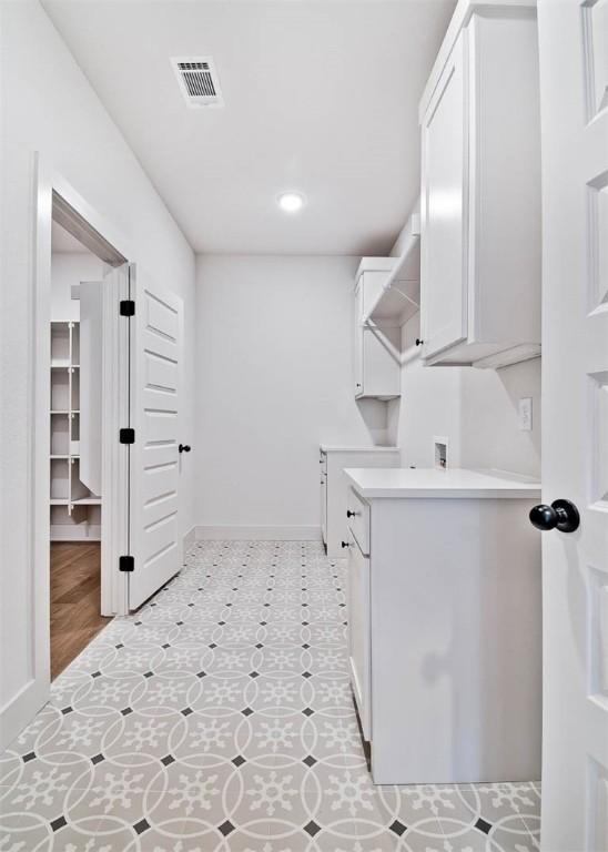 laundry area featuring cabinets and washer hookup