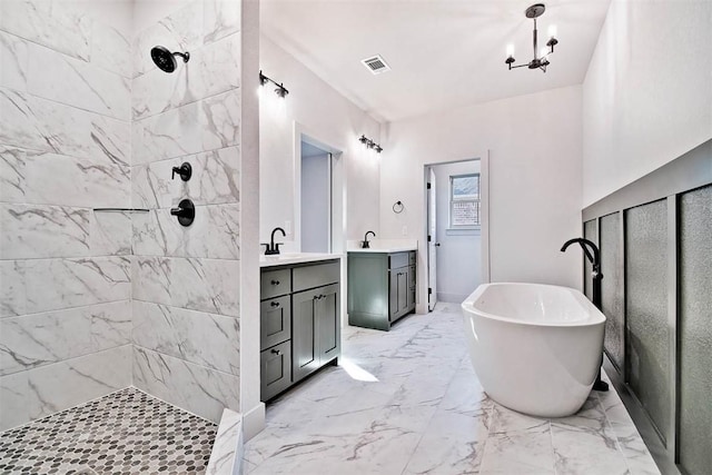 bathroom with vanity, shower with separate bathtub, and a notable chandelier