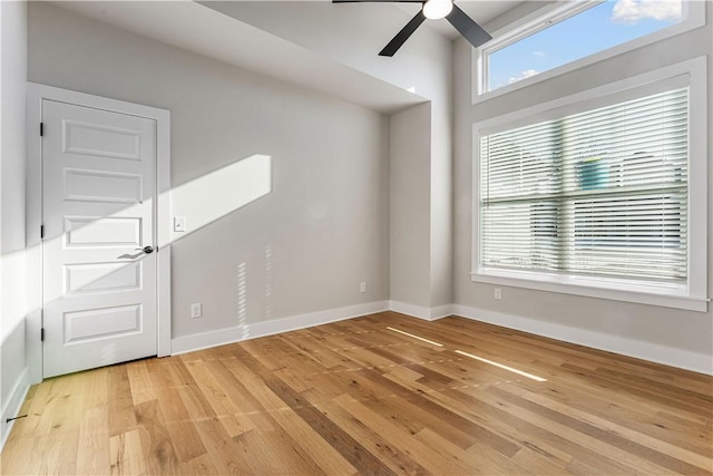 spare room featuring ceiling fan and light hardwood / wood-style flooring