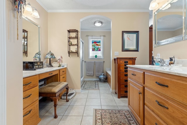 bathroom with tile patterned flooring, vanity, and crown molding