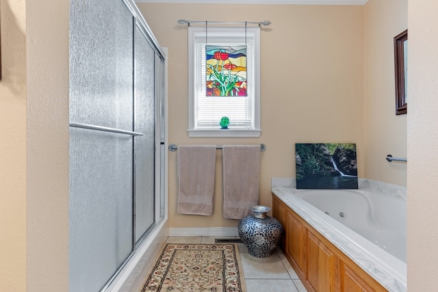 bathroom featuring shower with separate bathtub and tile patterned flooring