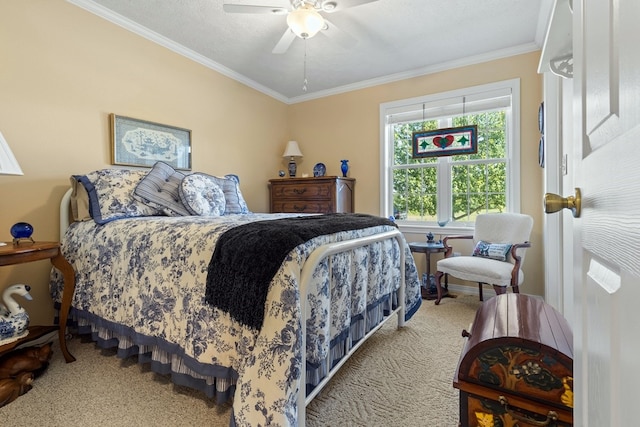 carpeted bedroom featuring ceiling fan, a textured ceiling, and ornamental molding