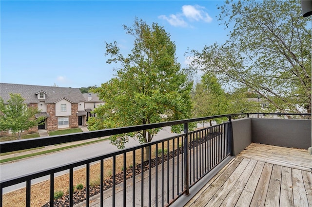 wooden terrace featuring a residential view