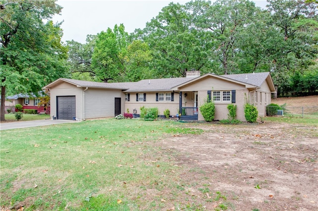 single story home with a porch, a garage, and a front yard