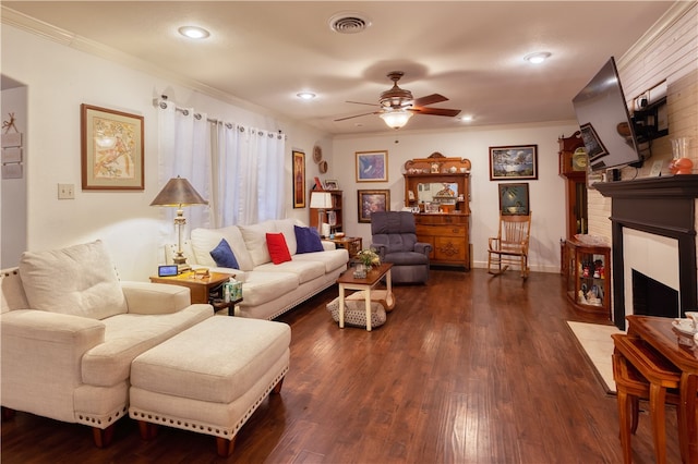 living room featuring ornamental molding, ceiling fan, and dark hardwood / wood-style flooring