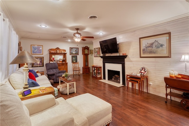 living room featuring ornamental molding, dark hardwood / wood-style floors, and ceiling fan