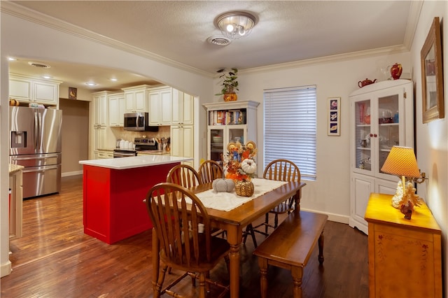 dining space featuring ornamental molding, a textured ceiling, and dark hardwood / wood-style flooring