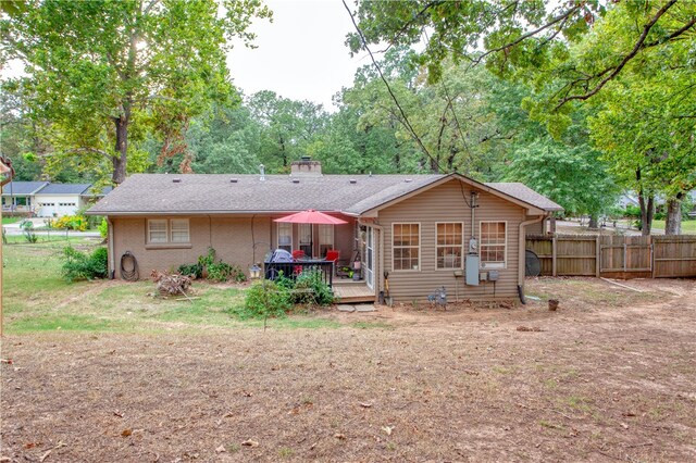 rear view of house featuring a deck