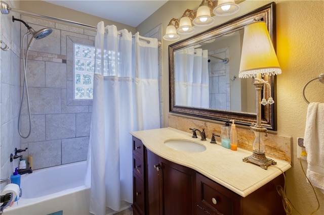 bathroom featuring vanity and shower / bath combination with curtain