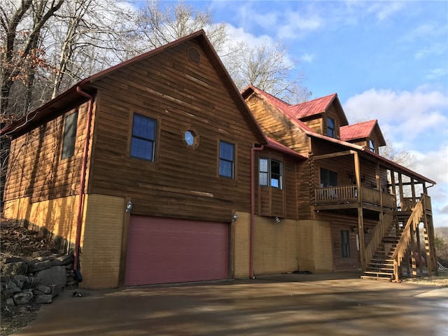 view of side of property with a garage