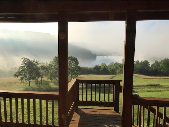 wooden deck with a yard